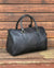 Ashwood leather holdall brown on wooden background back angle