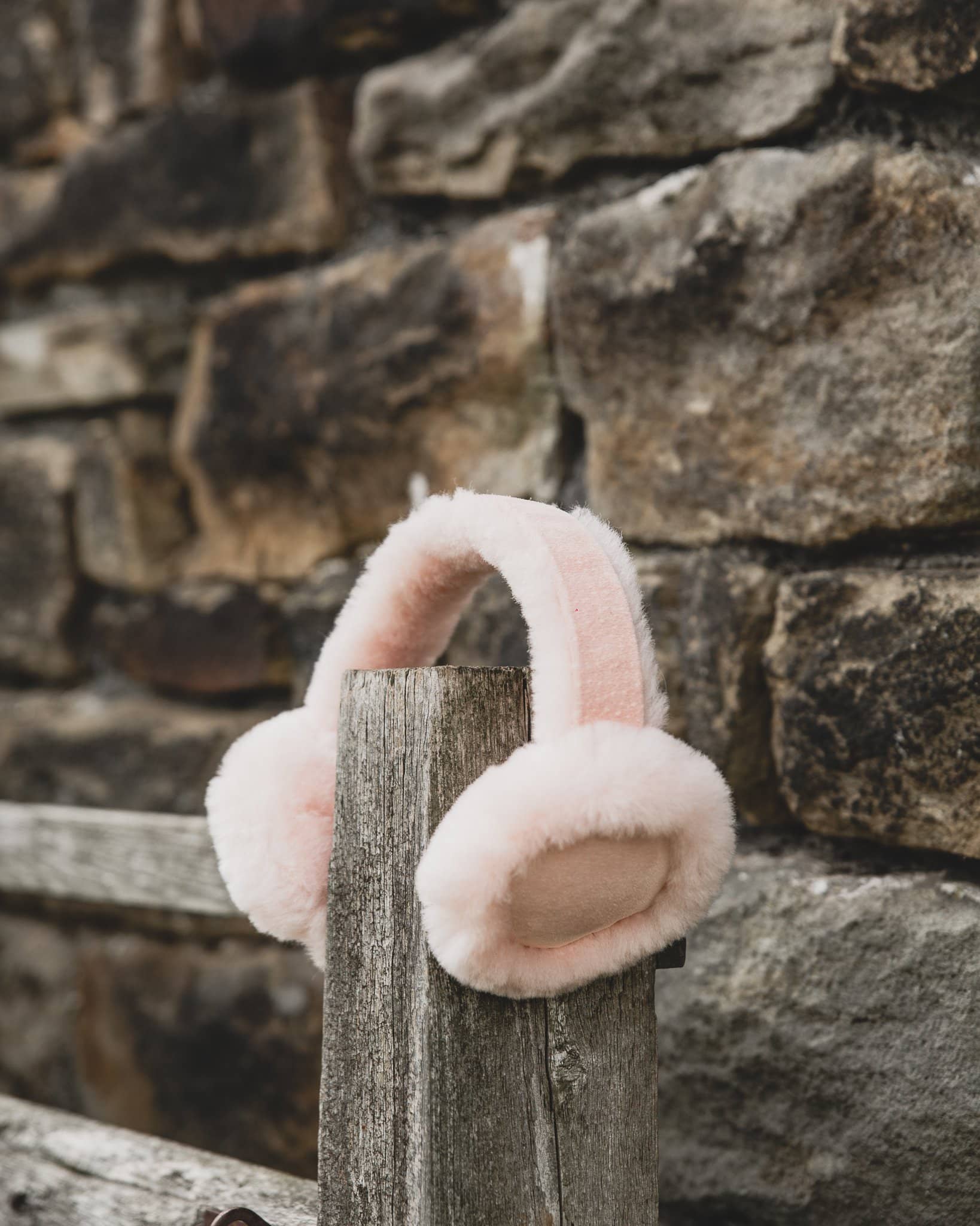 Nordvek kids sheepskin earmuffs 512-100 pink on fence front
