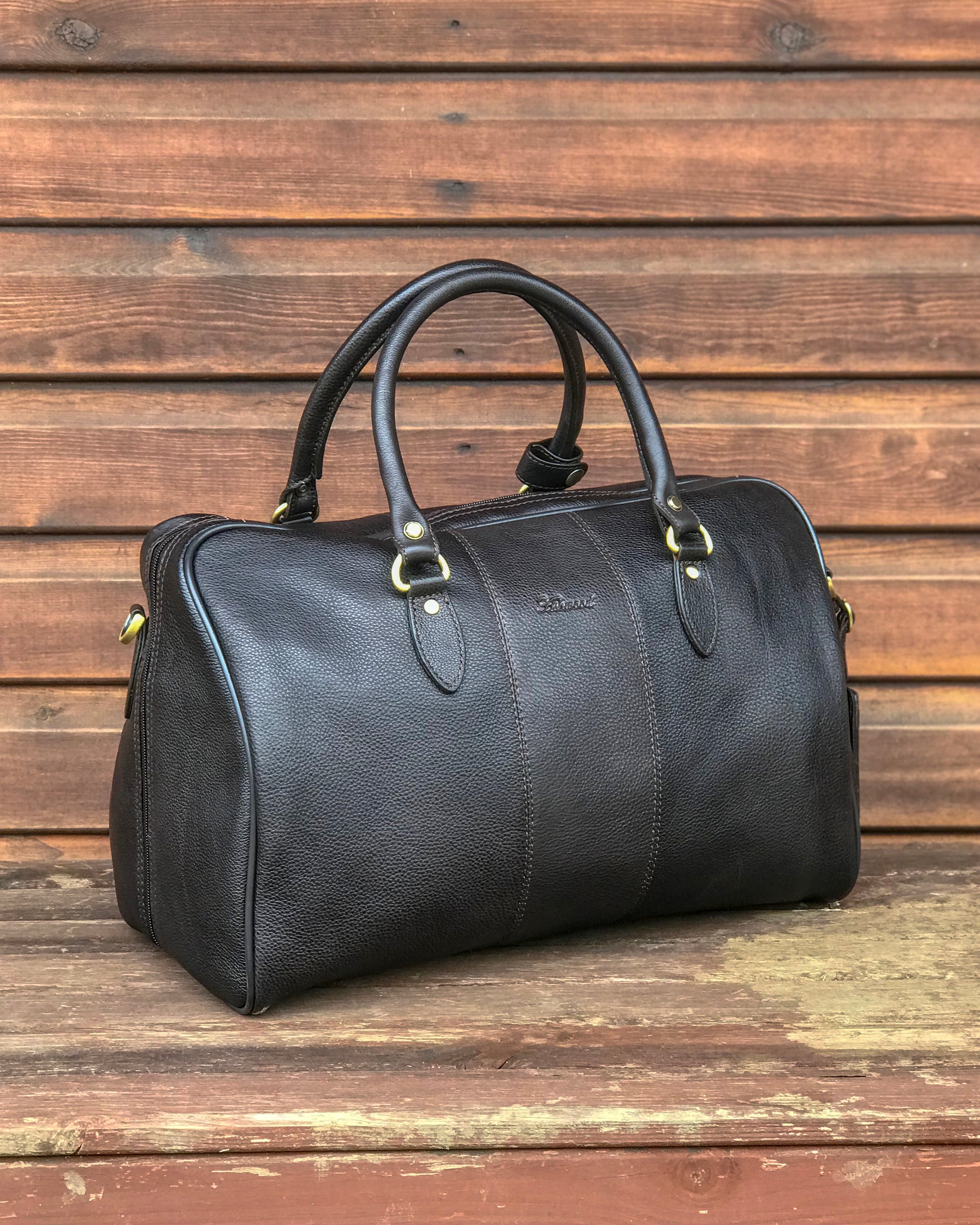 Ashwood leather holdall brown on wooden background back angle