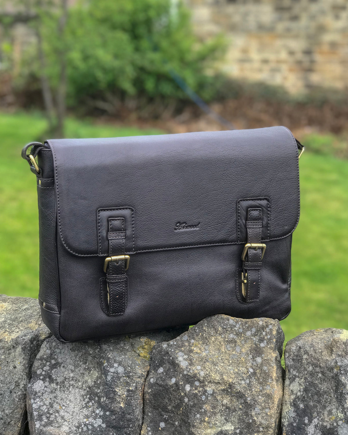 Ashwood jasper leather satchel messanger bag on stone wall brown black front