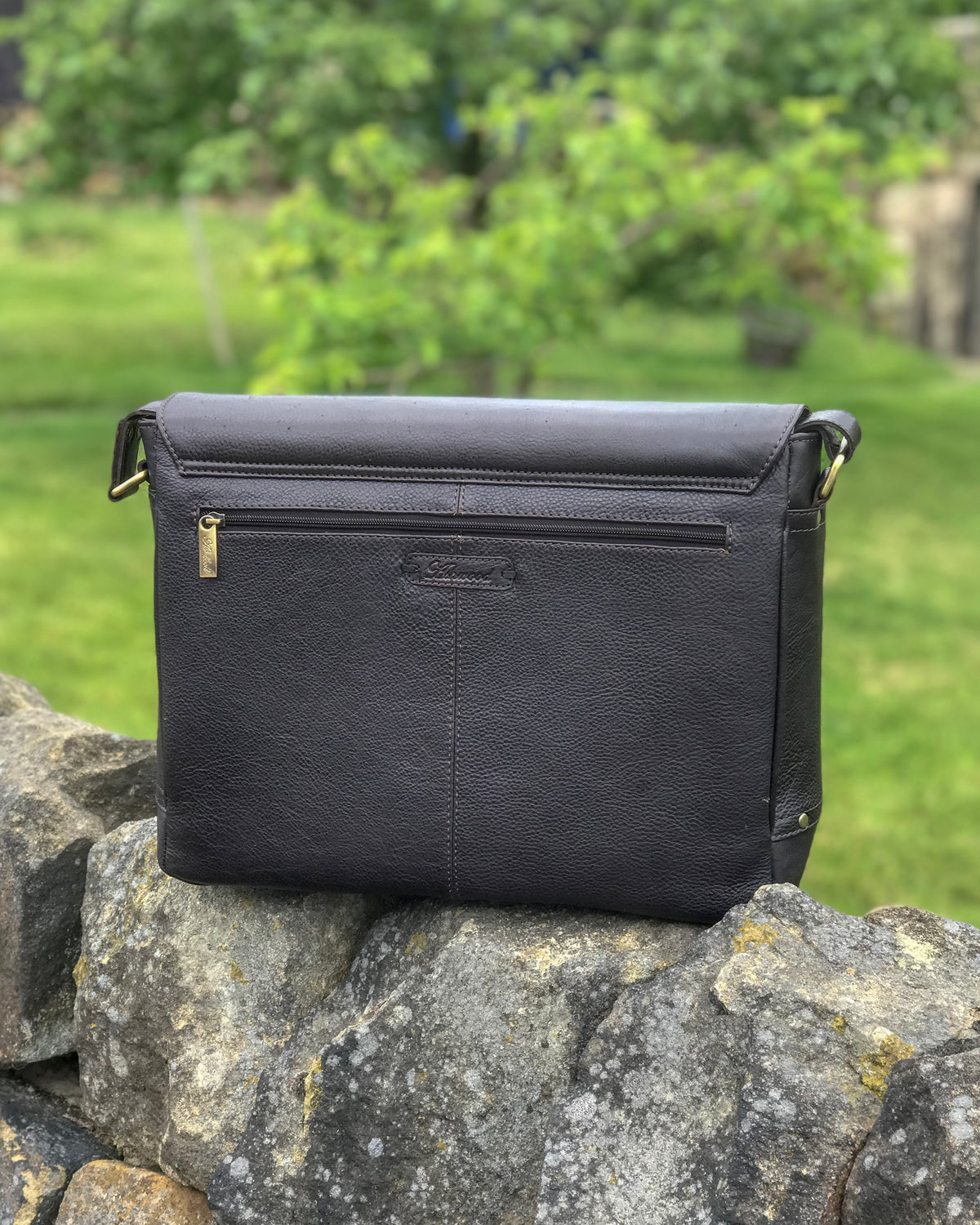 Ashwood jasper leather satchel messanger bag on stone wall brown black back