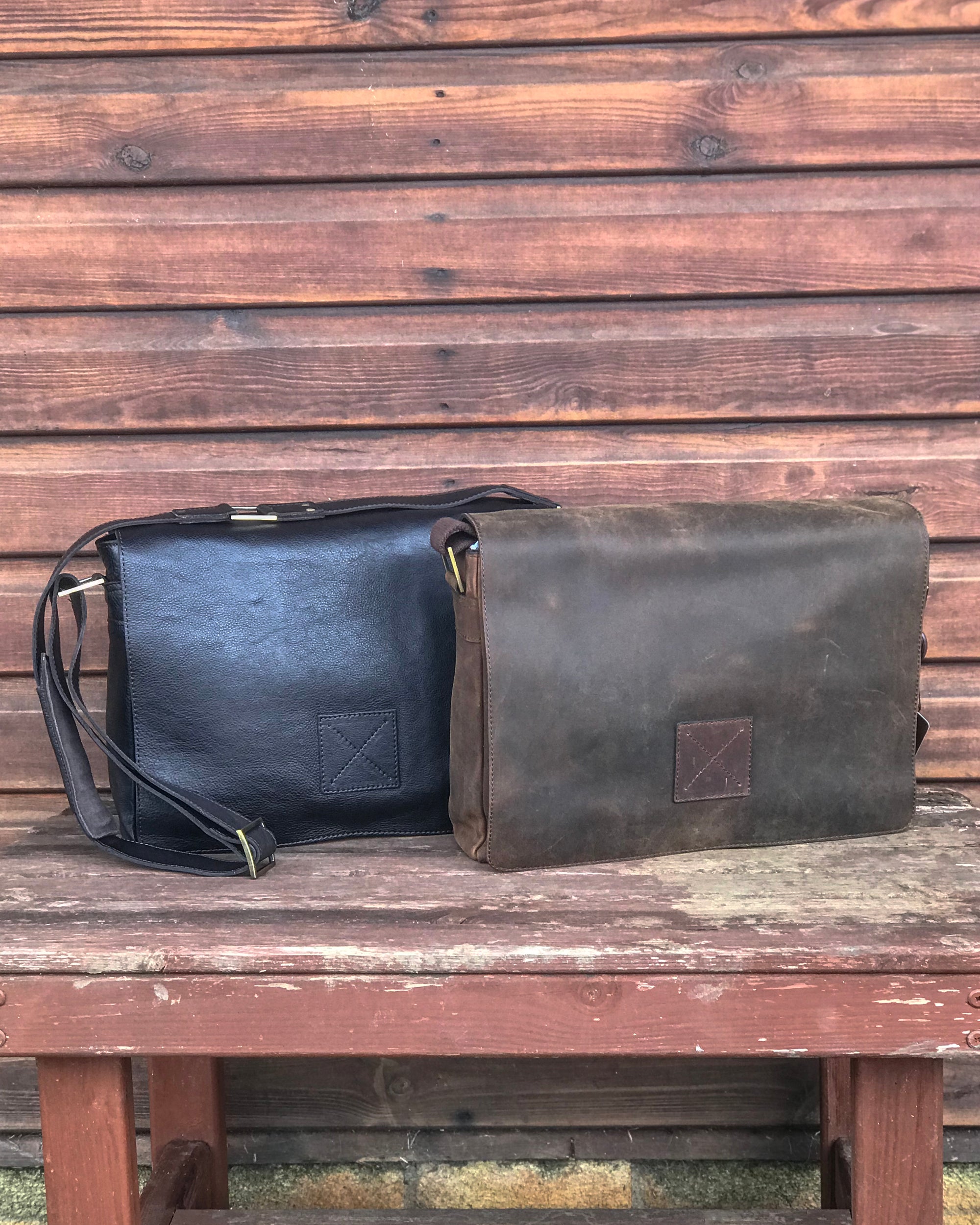 Ashwood collection of leather messenger bags brown mud on wooden bench