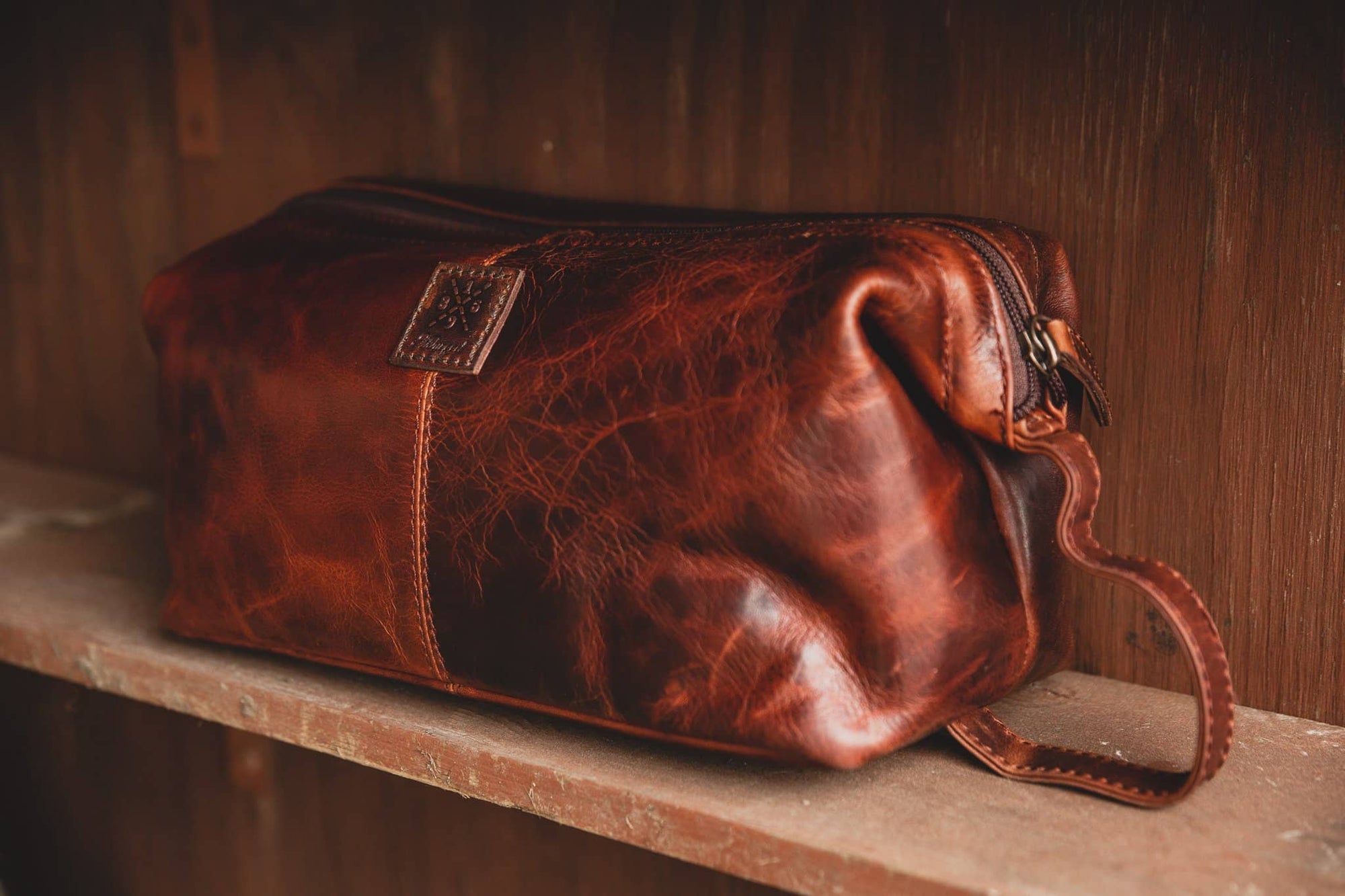 Ashwood wash bag seb on Wooden Shelf vintage tan