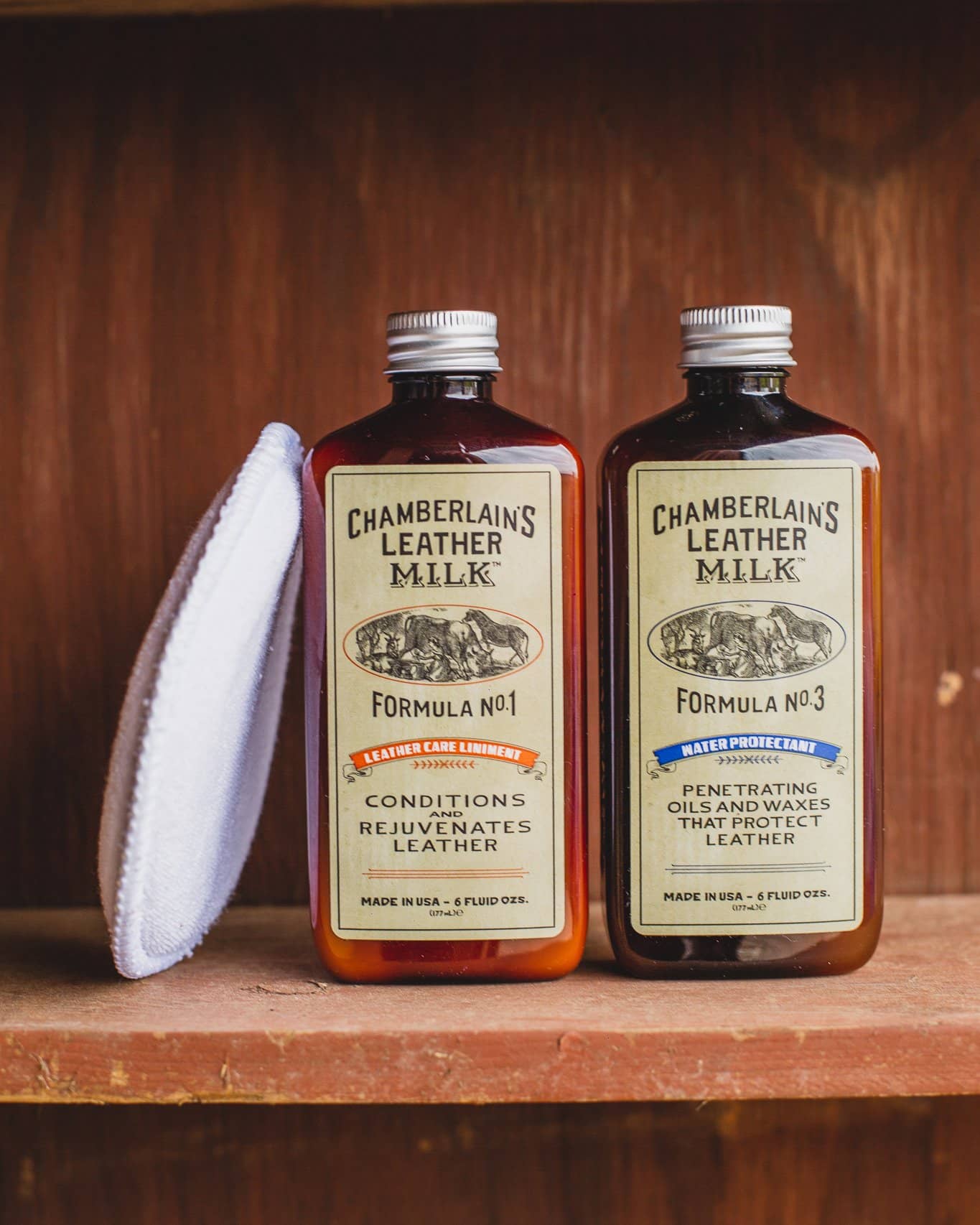 Chamberlains Leather Milk Pack of Lintment 1 and 3 on wooden shelf with pad