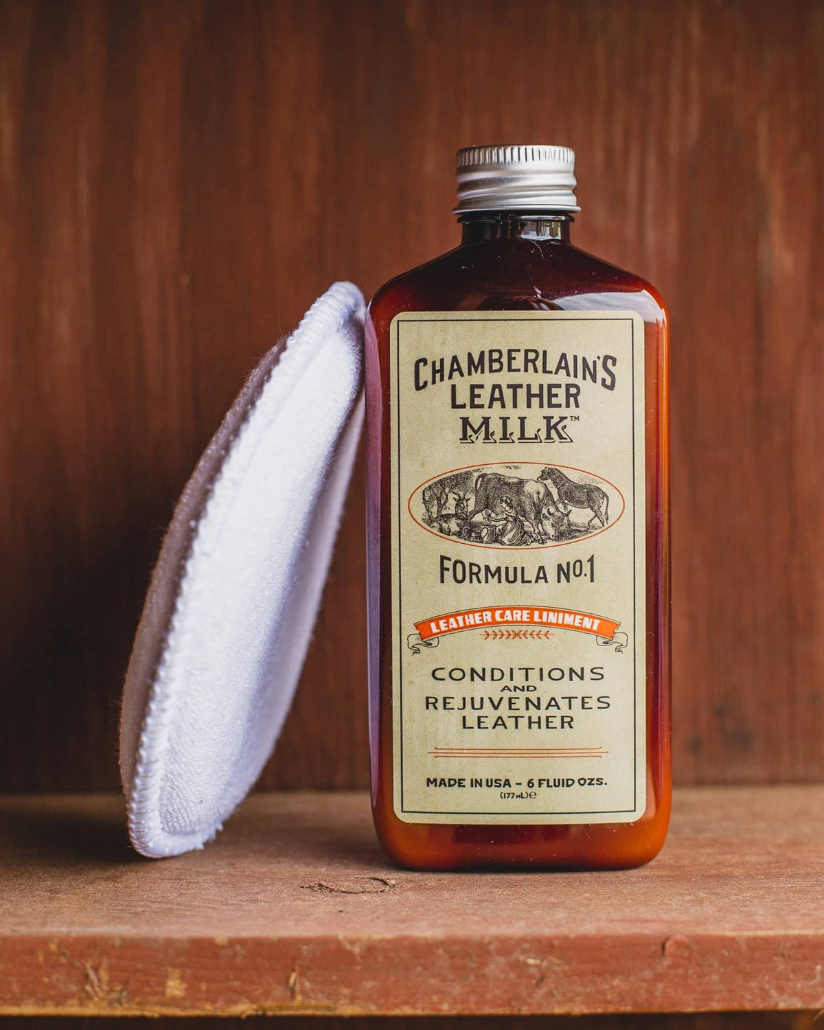Chamberlins Leather Milk Lintment 1 on wooden shelf with pad
