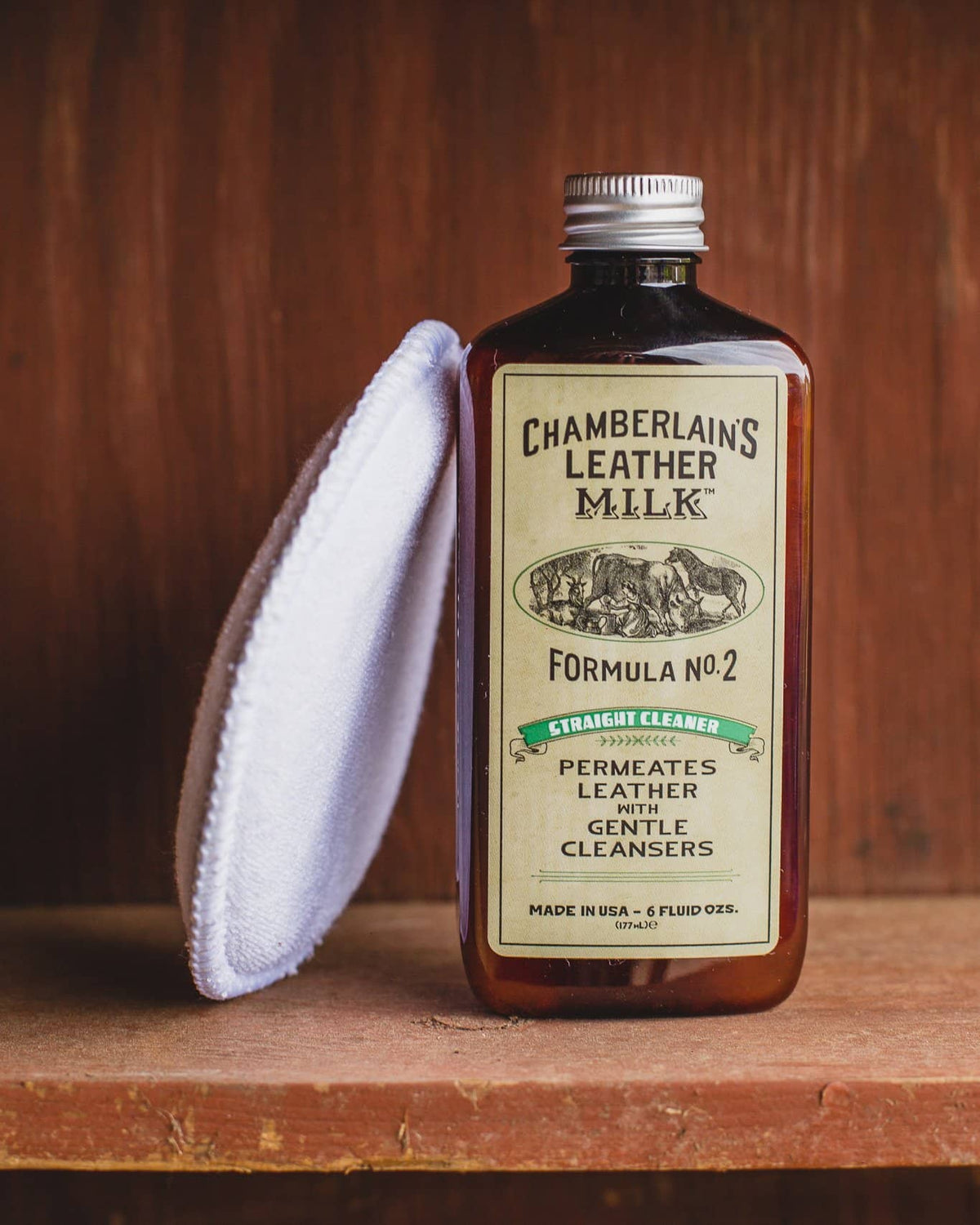 Chamberlins Leather Milk Lintment 2 on wooden shelf with pad