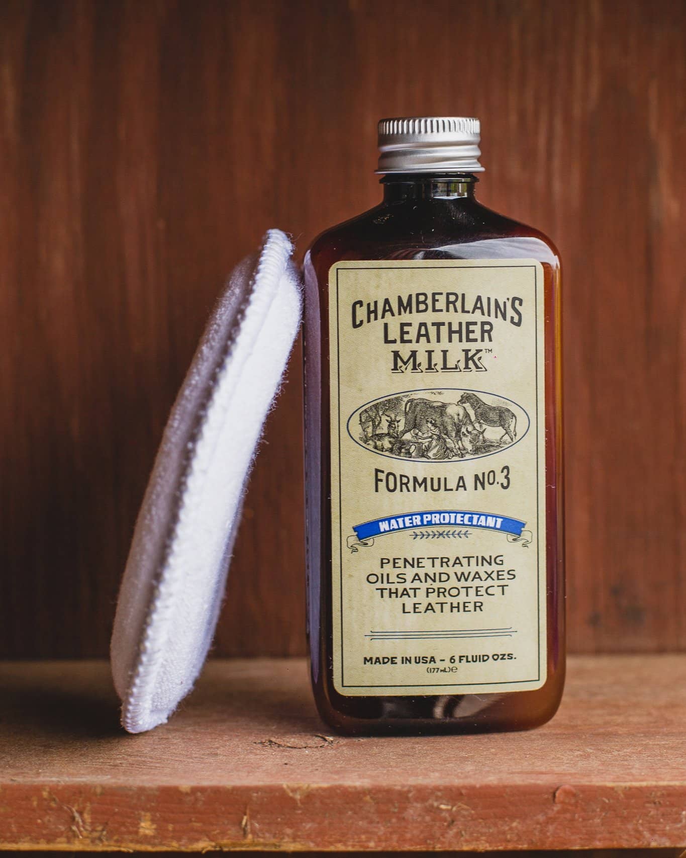 Chamberlins Leather Milk Lintment 3 on wooden shelf with pad