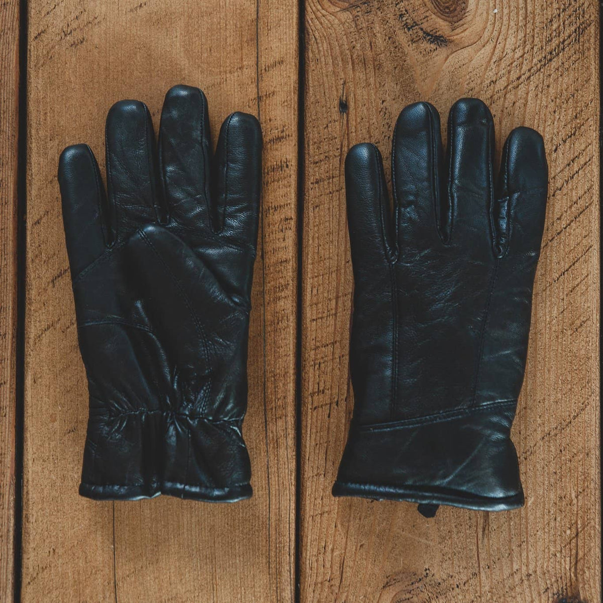 Nordvek mens black leather sheepskin 302-100 gloves on wooden background