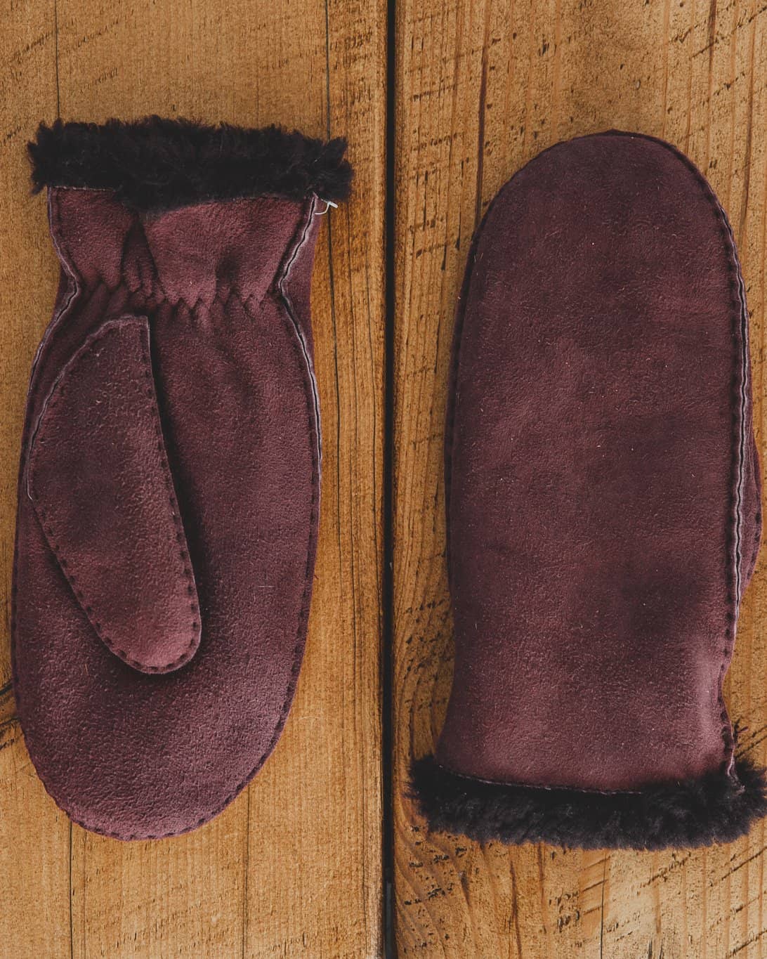 Nordvek womens sheepskin gloves 320-100 plum side by side on wooden floor