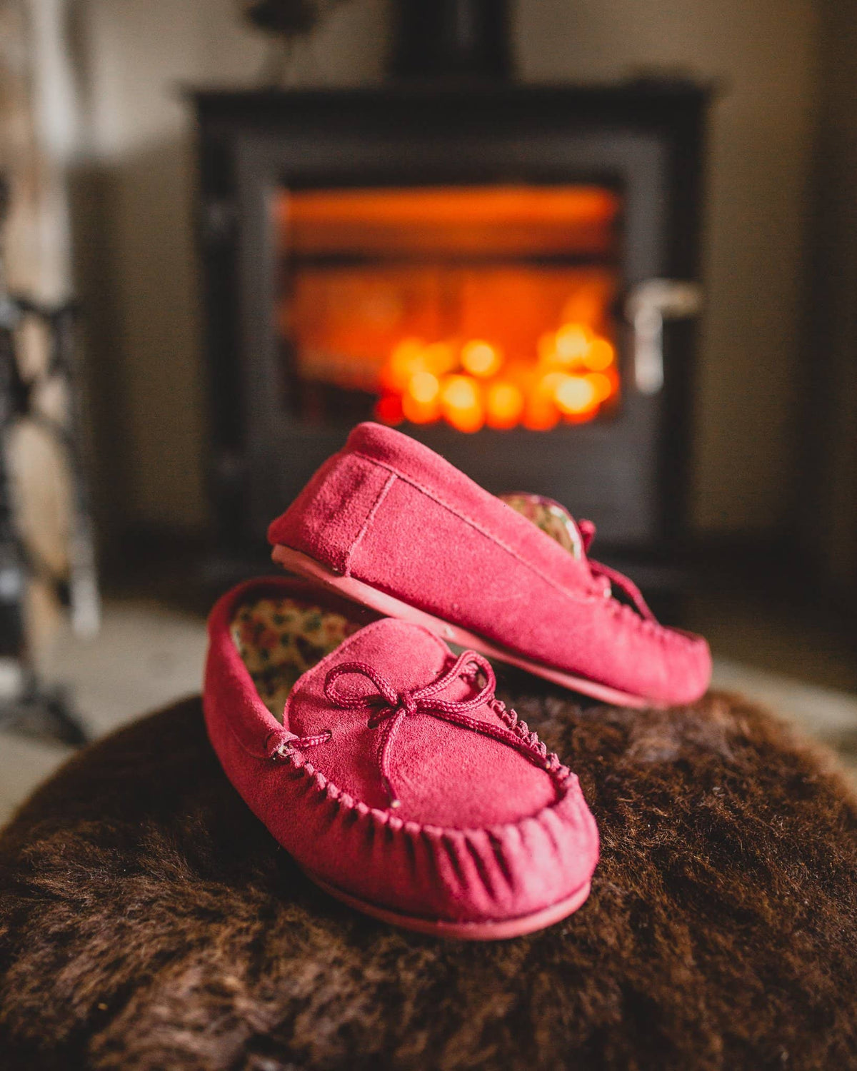 Nordvek womens moccasins hard sole  419-100 red pair in front of fire