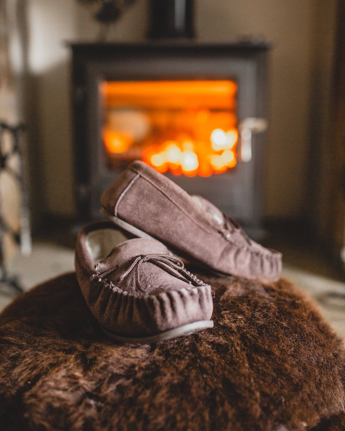 Nordvek mens moccasins hard sole  422-100 Chocolate pair in front of fire