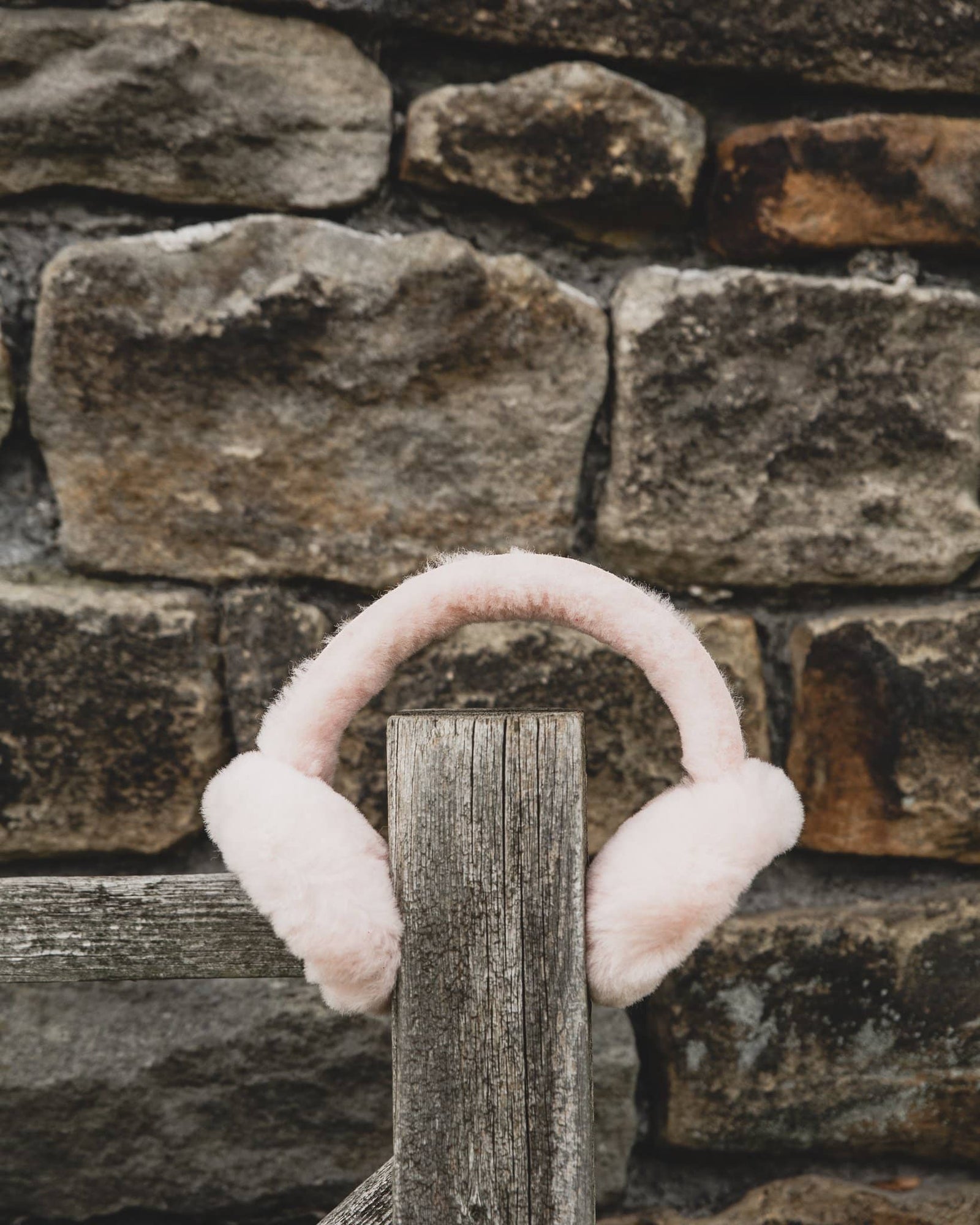 Nordvek kids sheepskin earmuffs 512-100 pink on fence front