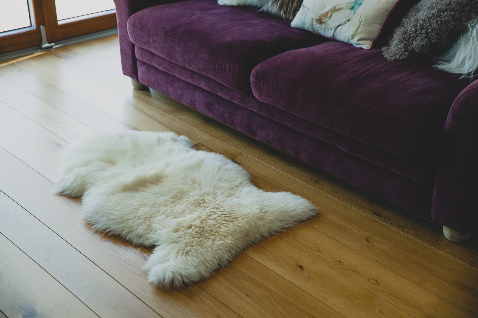 Nordvek sheepskin single rug 601-100 natural in front of fire