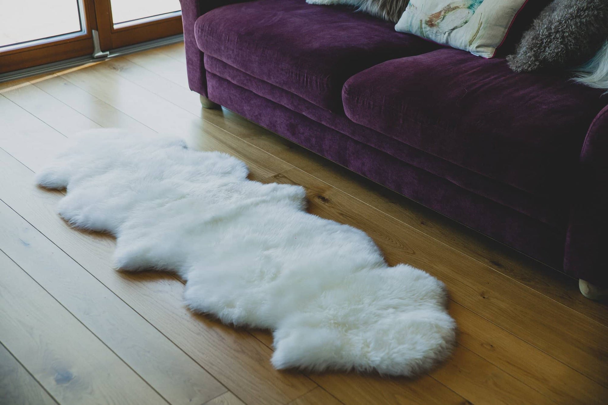 Nordvek sheepskin  natural rug 602-100 double in front of sofa close up