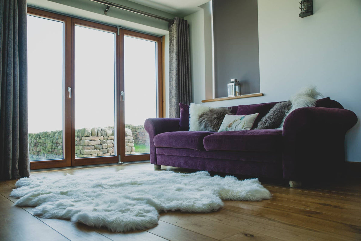 Nordvek sheepskin  natural rug 605-100 sexto in front of sofa