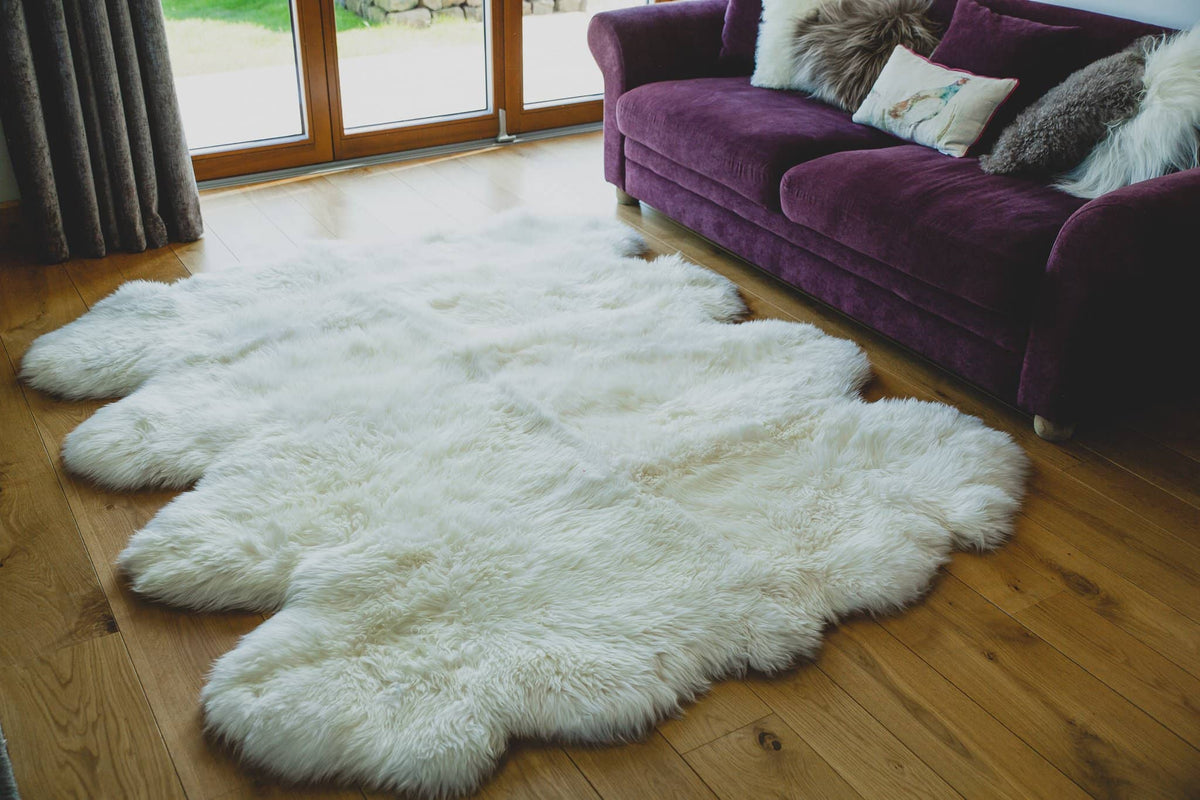 Nordvek sheepskin  natural rug 606-100 octo in front of sofa close up