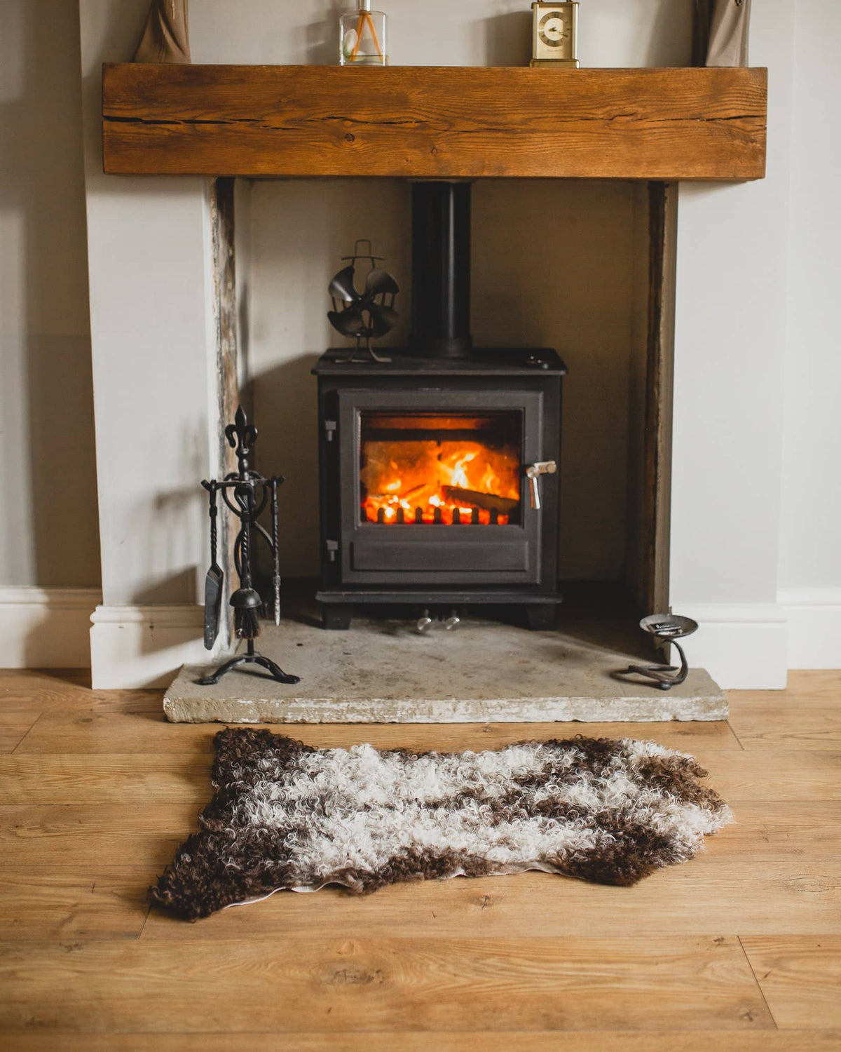 Nordvek Spanish sheepskin rug 616-100 design 3 in front of fire