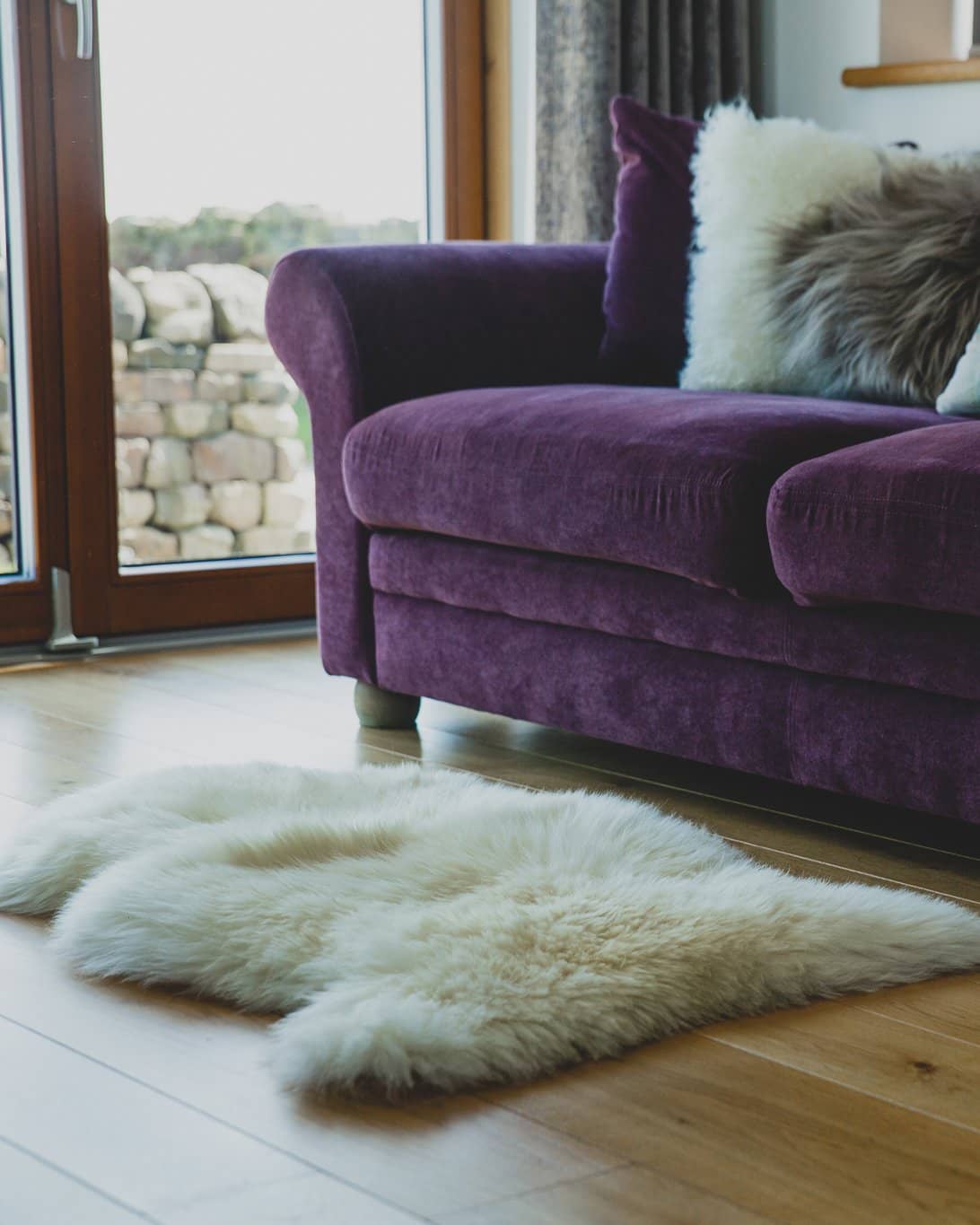 Nordvek kids sheepskin rug 620-100 natural infront of fire