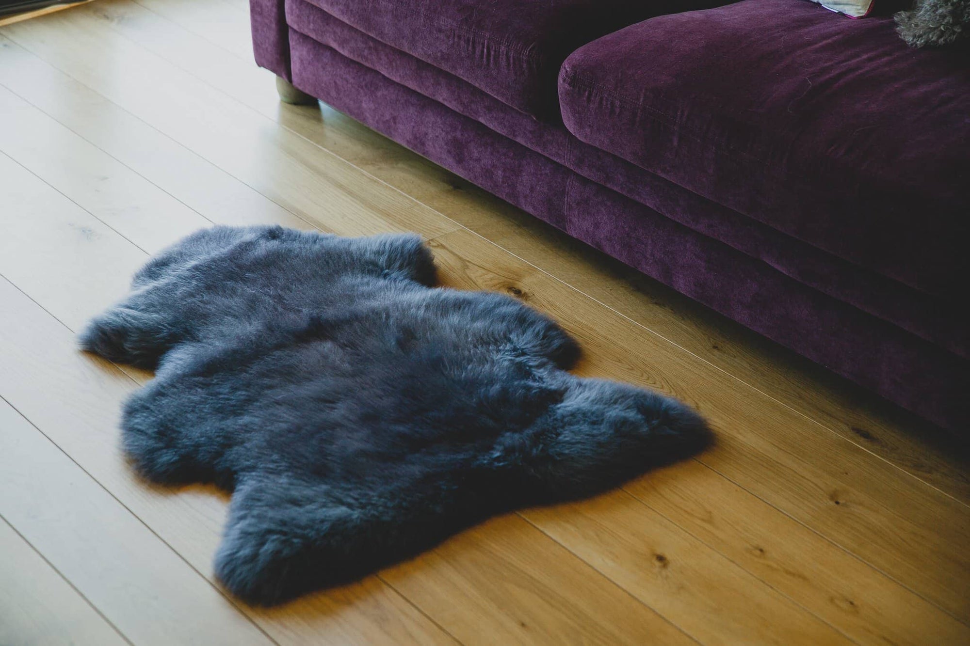 Nordvek kids sheepskin rug 622-100 natural infront of sofa