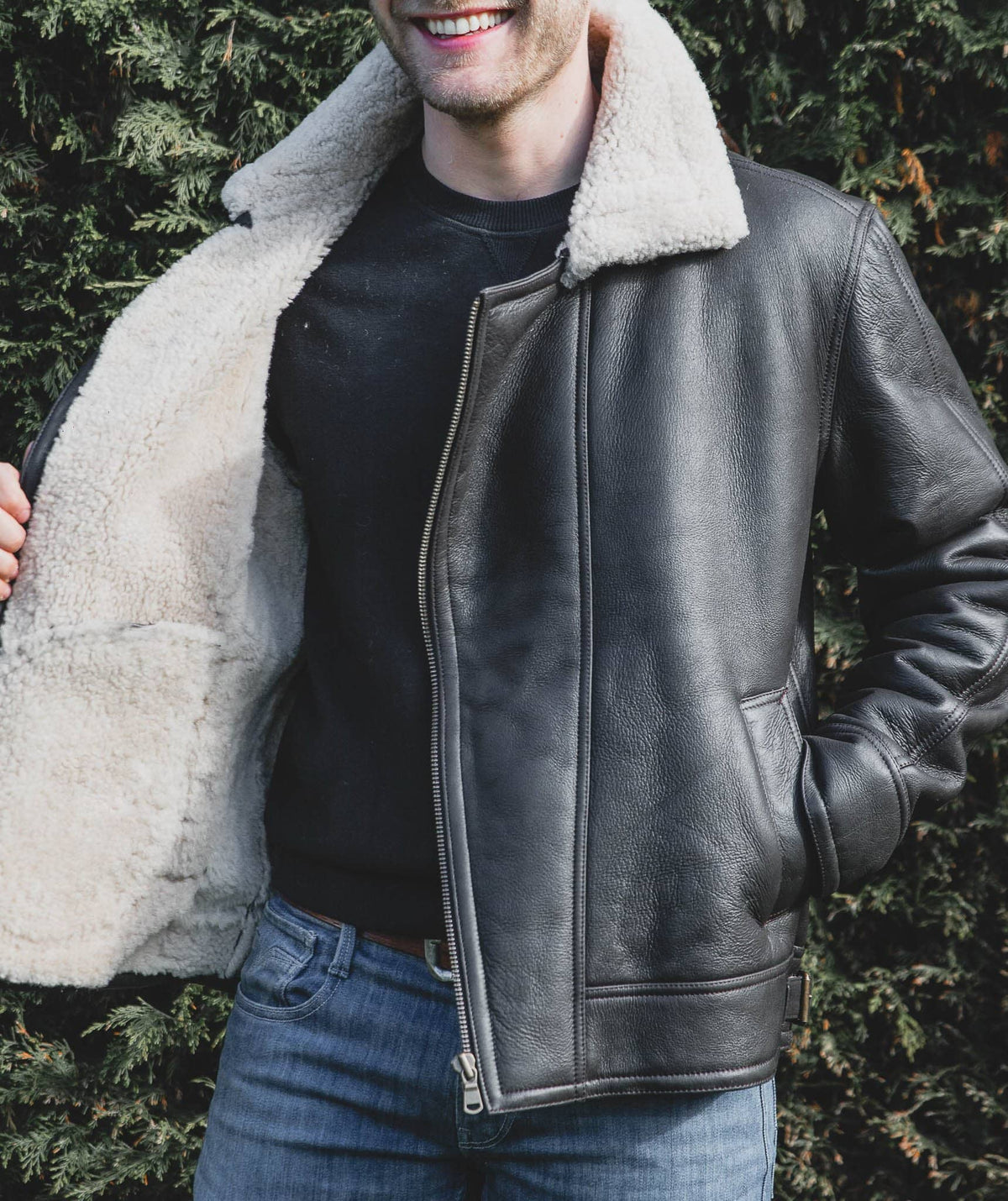 Nordvek mens sheepskin jacket 703-100 dark brown on model zipping up smiling