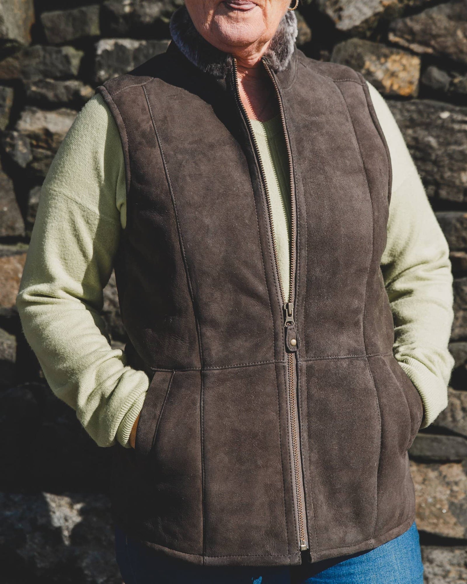 Nordvek womens sheepskin gilet 711-100 stone front in front of stone wall