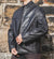Nordvek mens leather jacket 712-100 black on model zipping up stone wall