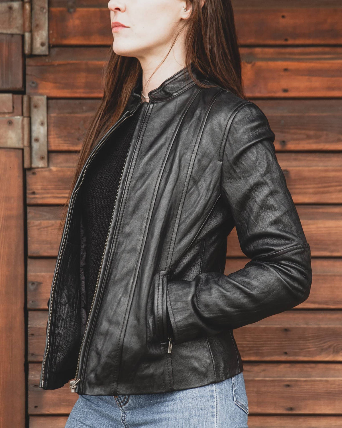 Nordvek womens leather jacket 714-100 black turned to side against stable door