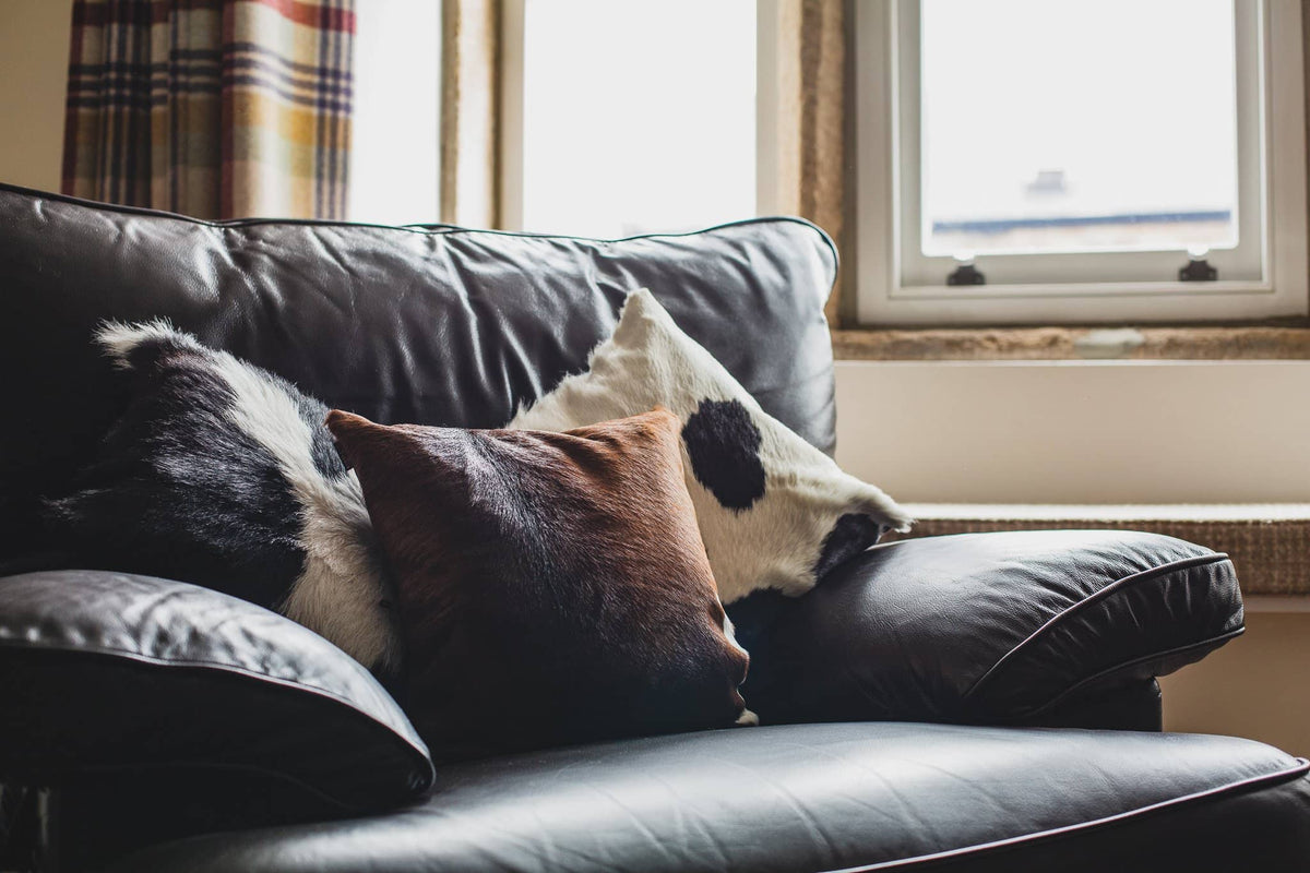 Nordvek cowhide cushion group shot black and brown 9007-100