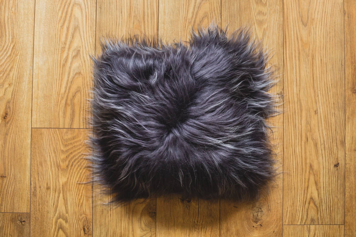 Nordvek Icelandic Sheepskin Cushion 9010-100 grey on wooden floor